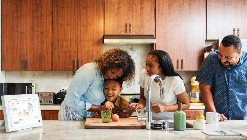 Family in the kitchen with a skylight calendar