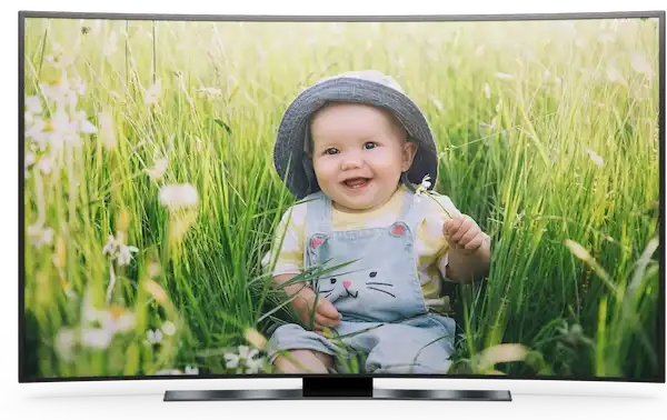 Photo of baby in fields on a tv screen.