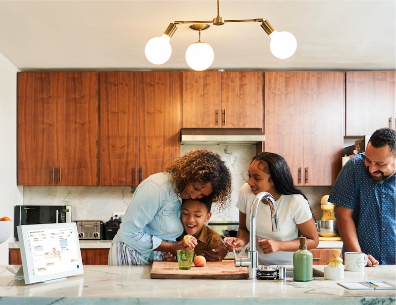 Family in the kitchen with a skylight calendar