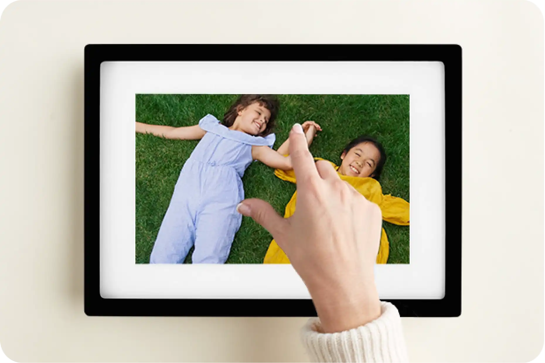 A customer touching the skylight frame which displays two children playing on grass